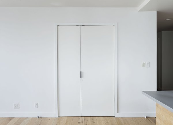 The workspace disappears behind custom doors.