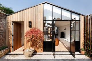 A London Shed Becomes an Airy Home Lit By Three Courtyards - Photo 1 of 13 -