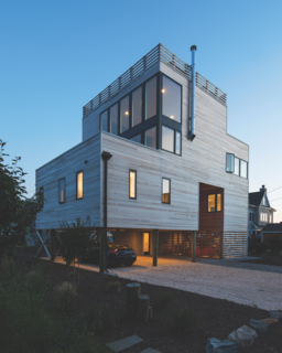 Located on the coast of New Jersey, the Sea Bright House often endures a damp sea breeze and chilly weather, given the time of year. Architect Jeff Jordan went with Western Red Cedar not only for it’s warm and familiar appearance, but also because it withstands the elements. 