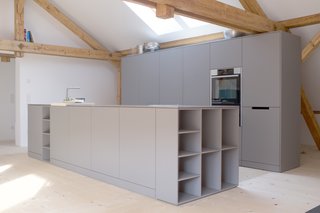 The couple’s private kitchen is covered in an easy-to-clean, water-repellent matte surface called Fenix. 