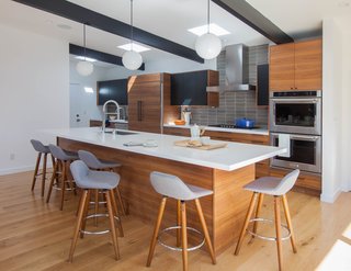 Nepacena liked that the "Nougat" slab, chosen as a nod to the 1950s style of the home’s original era, offered just the right hues to complement the space. She also chose it for its natural flecks of stone in the surface, reminiscent of terrazzo used during the mid-century period. 