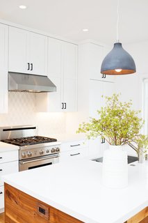 For this project, Johnson’s client requested an all-white kitchen, and Johnson knew Caesarstone "Blizzard," a consistent and pure white color, was right for the job. 
