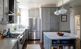 Designer Jessica Johnson used Caesarstone premium quartz to evoke a marble look in this kitchen. The exquisite color and veining create an authentic look while the material withstands the high day-to-day demands of the cooking space. 
