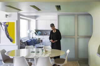 Hariri was determined that no area of the house was closed off, only to be used on special occasions. So her living and dining areas are an open space, separated from the kitchen by metal and glass doors that are rarely shut. On the occasion that they are, the doors still allow light and sound through, creating a sense of togetherness even with physical separation. 