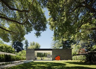 The rear section of the house contains a gym with sliding glass windows on both sides, a guestroom, and a kitchenette.