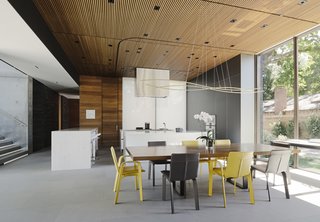 Hermès Sellier chairs in Jaune and Etain surround the custom dining table. Kristi Will Design assisted with furnishings.