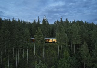 Set on 21 acres at the top of the Snoqualmie Valley, the 3,200-square-foot house represents a major lifestyle change for the Maxons, who previously lived in a split-level in a planned subdivision. "When you’re here, you just sit and watch what’s happening outside," says Lou. "It’s like the Weather Channel. We don’t even need the TV." Kim adds, "In spring everything explodes." Cedars, hemlocks, and vine maples shoot up from the fern-covered hillside.