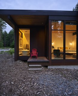 Outside the master bedroom, a small deck is tucked beneath the flat roof. The tub is by Maax.