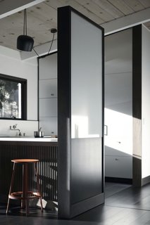 One side of the Functional Partition Wall is sculptural, meant to beautifully separate the kitchen space. 