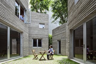 Every room on the upper level has windows that face into the courtyard, blurring the line between indoor and outdoor spaces.