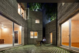 The ground floor houses the common areas such as the dining room and library.