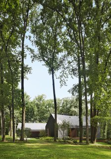 The house sits on a wooded three-acre site encircled by state-owned land.