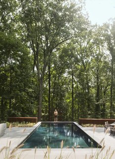In back, the swimming pool abuts a steep drop-off. 