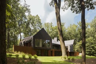 Landscape architect Kevin Campion went to great lengths to protect the poplar trees during construction. Delta Millworks charred the cedar gable fronts following the shou sugi ban technique.