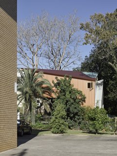 Building upwards—the treehouse is two stories tall—allowed the architect to keep the structure's footprint small, yet still hidden from view amongst the surrounding trees.