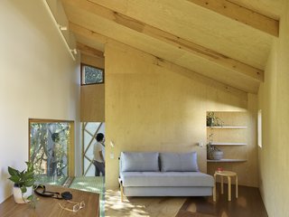 The interior of the tree house is made up of a set of informal spaces, including a loft on the top floor.