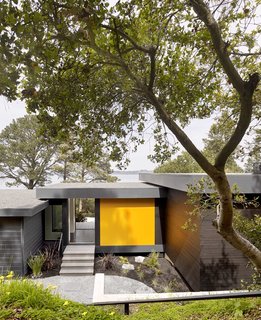 For Teaberry, a home overlooking the San Francisco Bay, Cary Bernstein Architect connects a new master suite and spa bath to a midcentury residence via a covered bridge.