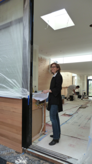 Cary Bernstein flashes a smile at the site of Hill House.
