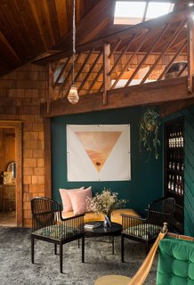 Sutherland opened the second story and converted it into a loft, which matches the ample seating below. 