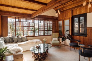 Original wood features mix with airy daybeds at the front of the property. 