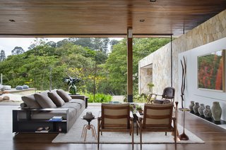 Moveable glass walls allow the home to open completely to the garden.
