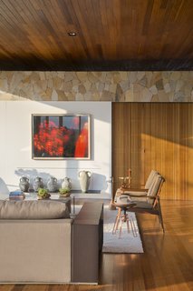 Interior designer Tici Andriani sourced furnishings from Casual Móveis. Galeria Eduardo Fernandes curated the home's extensive artwork.