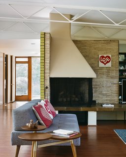 The brick walls extend indoors, where Girard used a hearth to organize the living area, presaging his and Eero Saarinen’s revolutionary concept for the conversation pit at the Miller House.