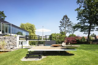 Much of the concrete and metalwork for the multilevel, L-shaped terrace had to be <br>redone. The Pantagruel picnic table is by Dirk Wynants for Extremis; the 1966 Adjustable Chaises are by Richard Schultz for Knoll.