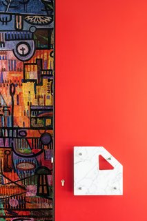 In the entrance, a team with the general contracting firm Martha uncovered an abstract mural that Engels painted himself and then plastered over. He also made the geometric door handle. Engels sourced the marble, found all over the house, from the 1958 Brussels World’s Fair, after the pavilions had been dismantled.