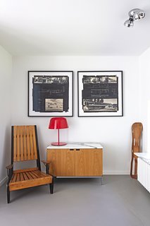 An Eames leg splint, a Florence Knoll credenza, and a chair by Engels furnish the office.