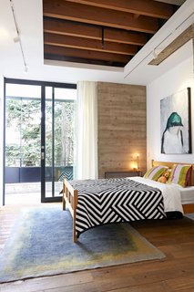 Lee Cline made the painting in the guestroom, which opens onto a new balcony.