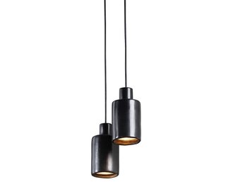 The Can light by David Pompa is housed in a lustrous ceramic casing made of barro negro, a Mexican clay that turns smoky black when fired. 