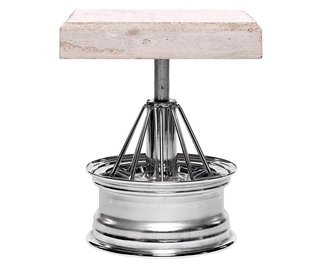 Dozie Kanu’s Table on 84s, a slab of concrete sitting on an elbow wire car rim, inserts car culture signifiers from Houston into the dialogue beween art and design.