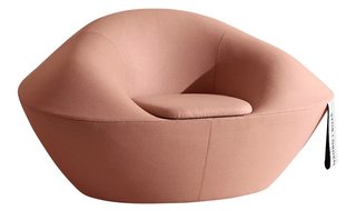 Designed by Jennie Adén with Hanna Stenström, the wool Fortuna armchair borrows its shape and name from the Chinese fortune cookie.