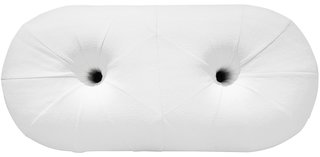 The pill-shaped Hole bench by Estudio Persona features a seat of generously <br>stuffed white upholstery punctuated by two circular openings. 