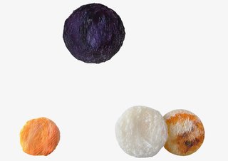 Crafting Plastics! Studio pioneered an eco-friendly "bioplastic" to create a series of round, <br>hand-crafted light fixtures called Collection 4. The shaggy strands of material were dyed using plant pigments. 