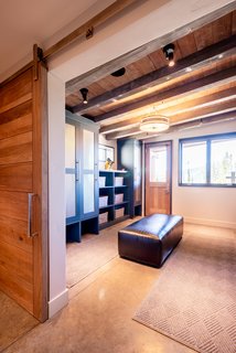 Ski-in, ski-out access—and a dedicated ski room—give the homeowners direct access to the slopes.