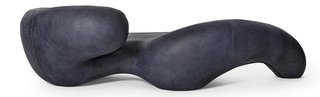 Rich Mnisi’s sinuous chaise lounge is wrapped in <br>navy-colored leather.