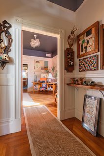 Needlepoint from Chien's grandmother can be found covering the wall of her entryway.