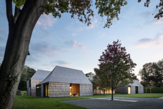 For Underhill in Matinecock, New York, Bates Masi + Architects worked with a shingle manufacturer to find thinner widths that would exaggerate their lengths, creating a more dynamic facade.