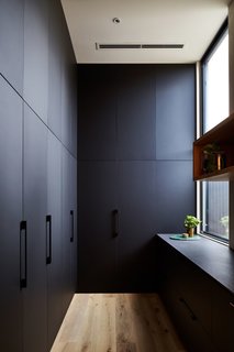 Additional storage in the rear of the kitchen ensures tidiness.