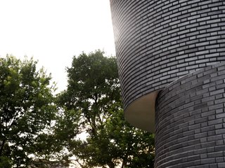 Manganese ironspot bricks undergo a powerful, transformative process, and in the end they have a metallic sheen that changes throughout the day. 