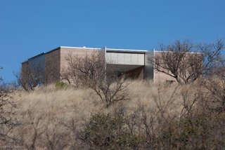 Rick Joy Studio's Adobe Canyon House in Patagonia, Arizona, features four solid corners of rammed earth that link the home to the landscape.