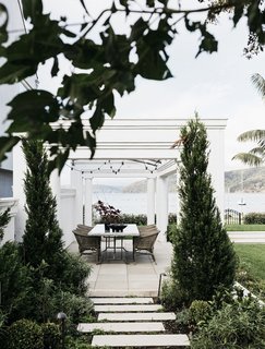 A pergola over the dining area allows for privacy without obstructing the phenomenal views.