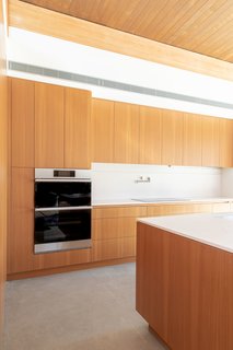 On top of seamlessly blending into the design of the room, "one of the great things about the microwave/oven is that it has over 150 preset cooking settings, so you can do all these things like "healthy fry" and dehydrate your food, which I’m excited to start testing out," Meelena adds.