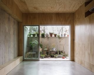 How They Pulled It Off: Warming Up a Concrete Basement to Match a Plywood Home