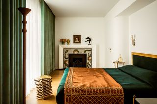 How They Pulled It Off: A Glittering Snake Mosaic Fireplace in a Whimsical Parisian Apartment