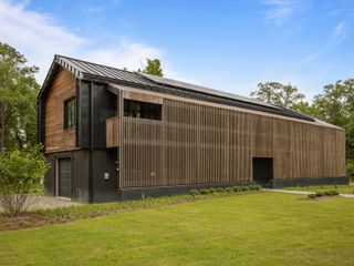 An Off-Grid Home Inspired by North Carolina’s Historic  Tobacco Barns Asks $2.8M