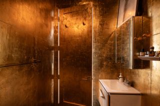 How They Pulled It Off: A Small Apartment Bathroom Dripped Out in Gold for Under $1,000