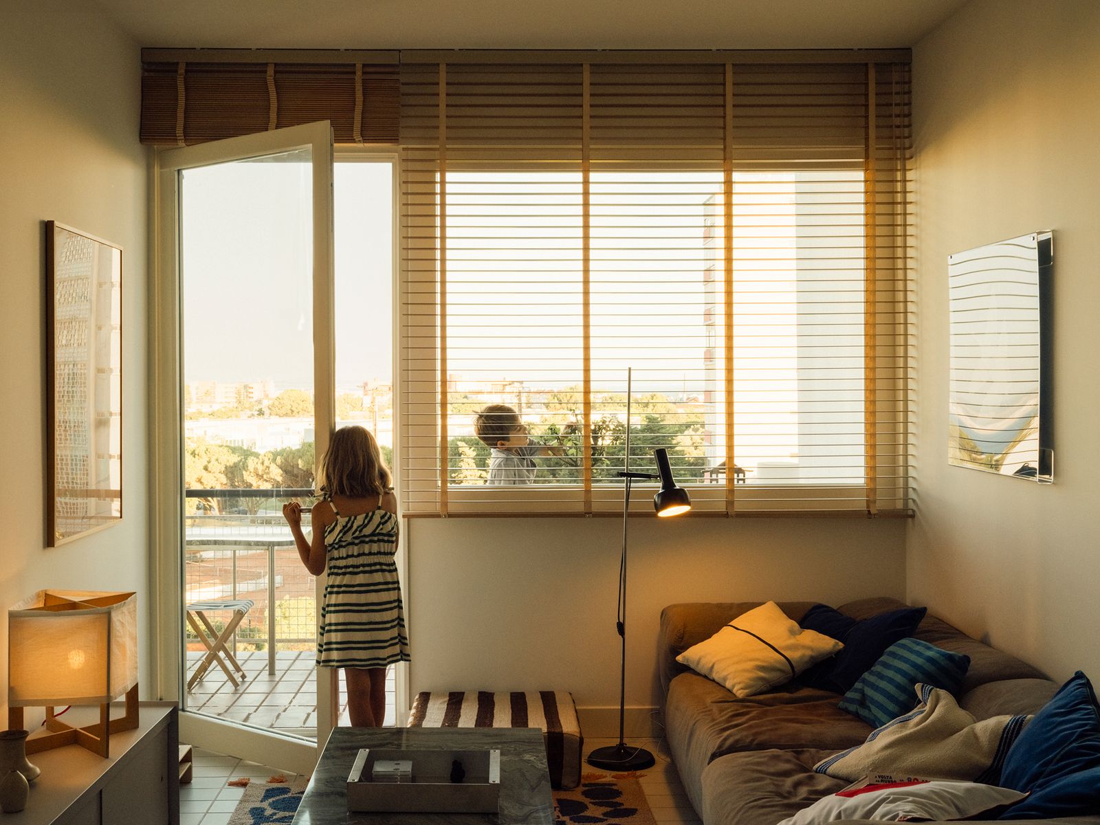 Plywood Built-Ins Reframe a Family’s Flat at a Revered Modernist Development in Lisbon